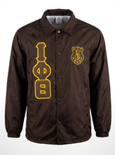 Load image into Gallery viewer, Brown jacket with yellow symbols and emblem on a white background